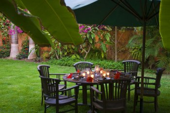 Outdoor Dining Table in the Lush Gardens Outdoor Dining Table in the Lush Gardens at Quinta Christileen, a luxury beach front vacation rental in Punta Mita, Mexico